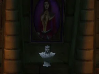 Le buste du prêtre dans sa niche, sous son tableau.